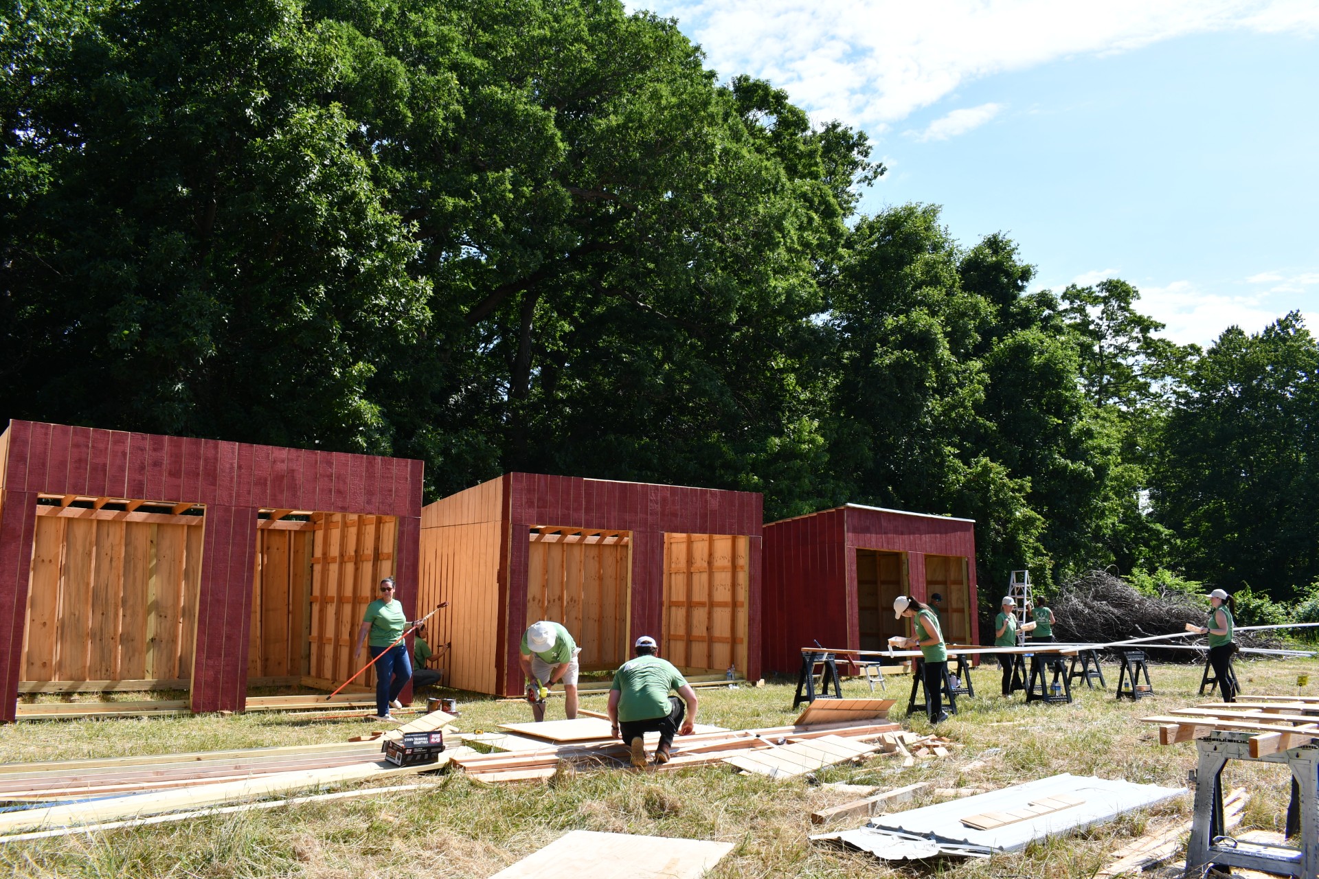 Employees from New Jersey Resources help build horse run-ins at Allaire Community Farm during the company’s annual NJR You Days.